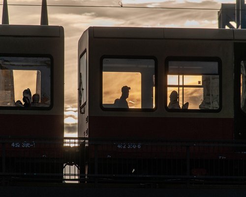 View of heavy city traffic from a passenger window during the evening commute